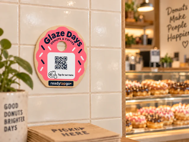 Glaze Days compact donut menu sign mounted on a cafe wall